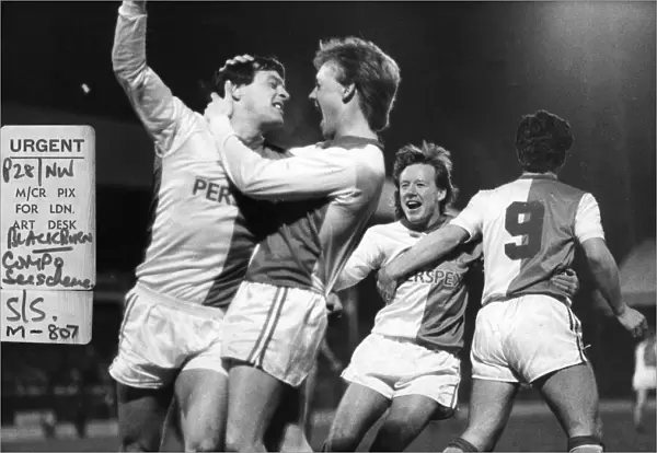 Simon Garner (left) Blackburn Rovers football player celebrates after scoring a goal with