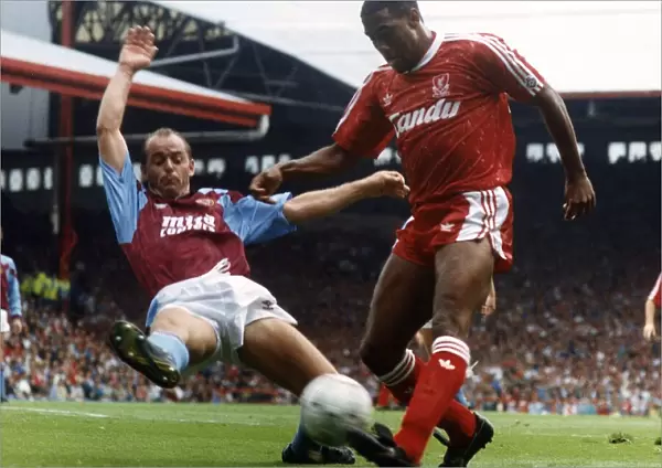 John Barnes (R) playing for Liverpool against Aston Villa 1990
