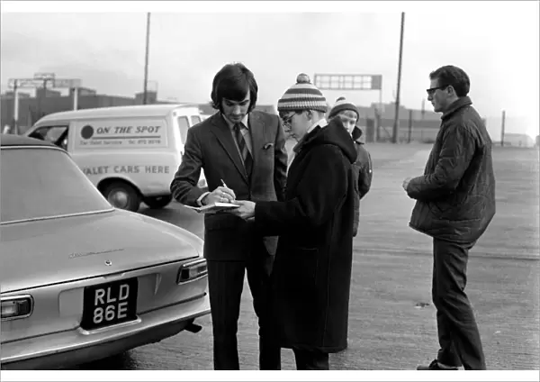 George Best signs autographs and boards the coach at Old Trafford he has just been fined