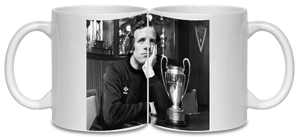 Bobby as he sits and ponders, with a replica of that famous trophy. October 1979 P009692