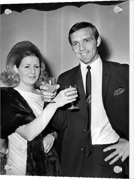 Jeff Astle and wife toasting each other at a reception after West Bromwich Albion