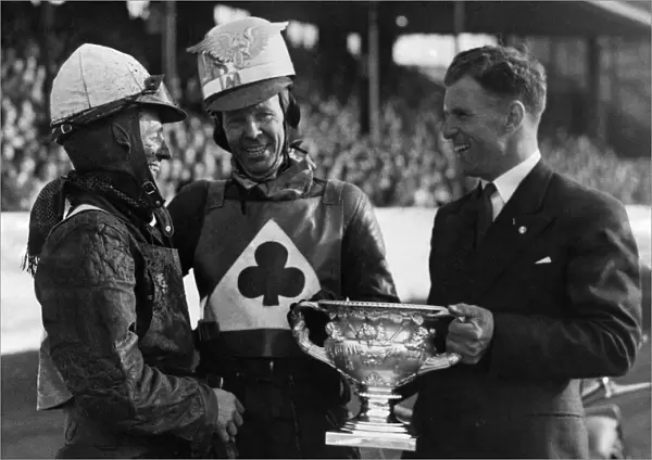 Jack Rowley of Manchester United presenting the cup to Speedway champion Jack Parker