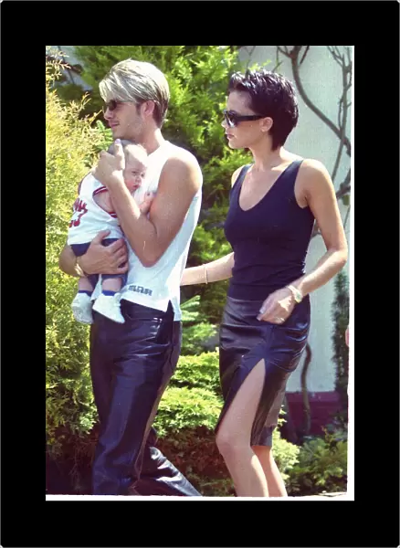 David Beckham and Posh Spice with baby Brooklyn July 1999 outside their home two days