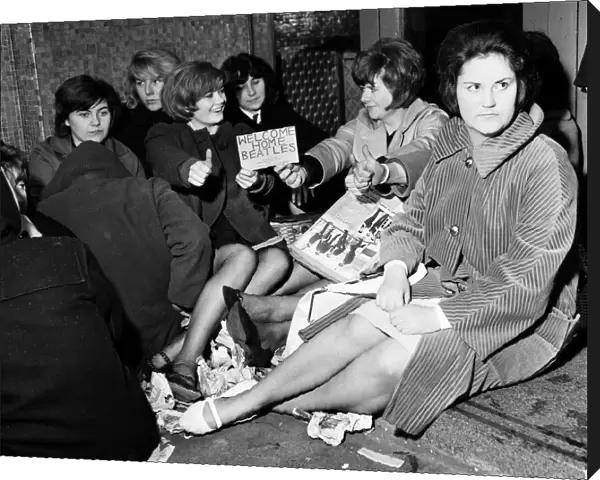 Teenagers queuing in the rain at The Majestic Ballroom, Birkenhead for tickets to see The