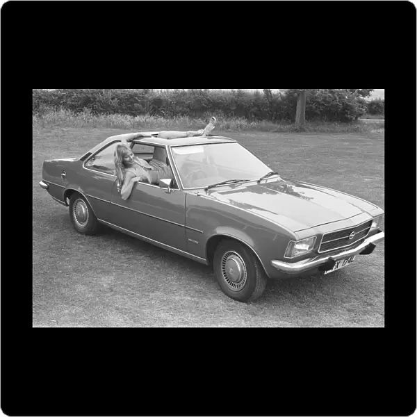 Reveille model Angela Jay seen here posing with a Opel Kadett car first prize in a