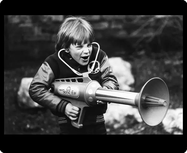 Seven year old Matthew Allen tries out his new sonic laser gun. 29th January 1979