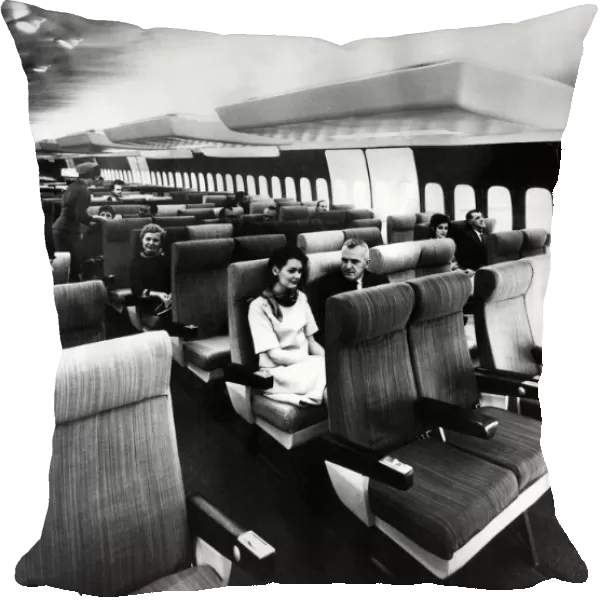 Passengers sit inside the massive interior of the Boeing 747. 12  /  01  /  1970