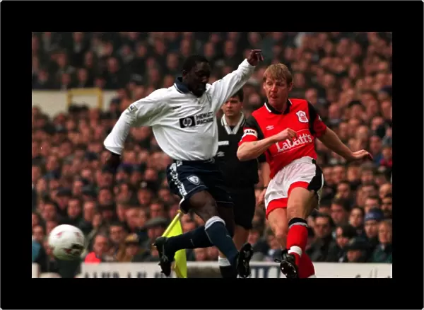Stuart Pearce of Nottingham Forest shoots past Ruel Fox of Tottenham during FA Cup Replay