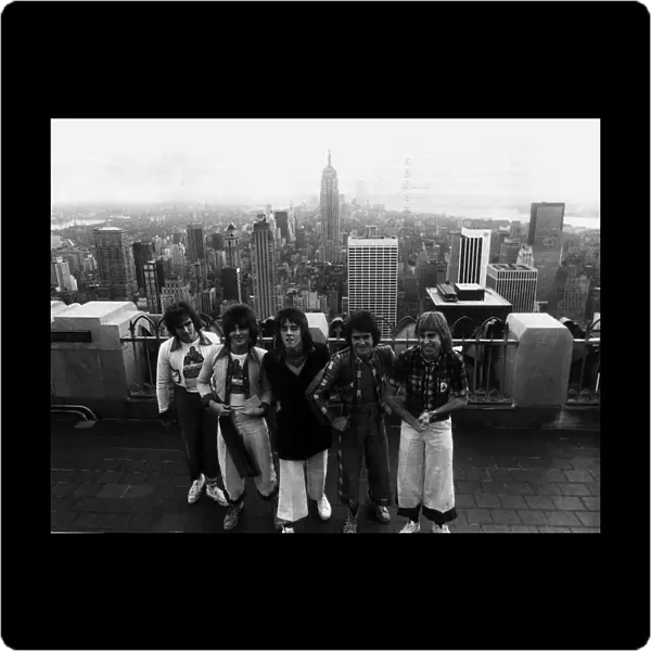 Bay City Rollers standing on top of the RCA building in New York during their first tour