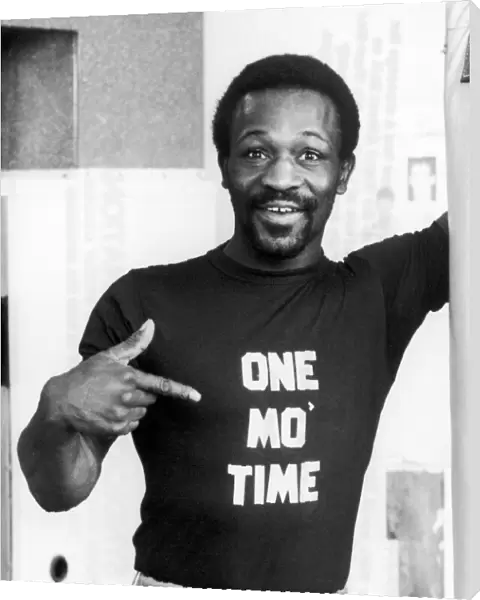 Boxer Maurice Hope wearing a t-shirt with a message for his opponent Reg Ford of Gyana