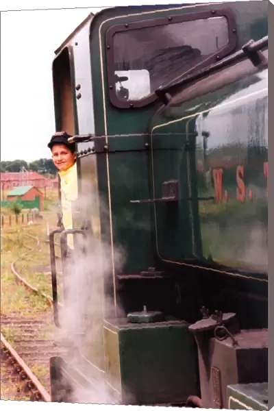 Michael Nelson, 9, from Sunningdale School, sunderland on a steam locomotive at Bowers
