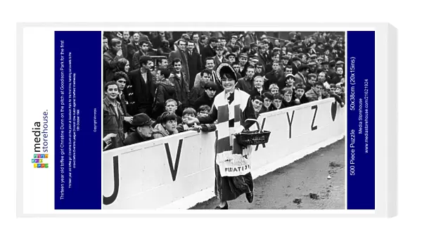 Thirteen year old toffee girl Christine Dunn on the pitch at Goodison Park for the first