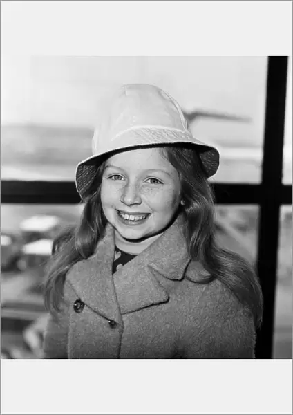 Lena Zavaroni, aged 10, pictured at London Heathrow Airport, to catch flight to Glasgow