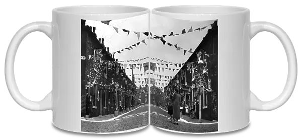 A Manchester street decked out with coronation decorations in celebration of