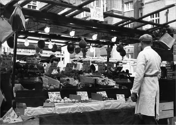 Greengrocers stall in East Street Market, London. circa 1965
