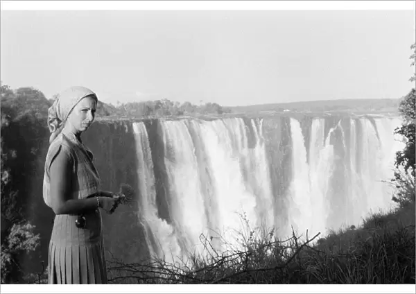 Princess Anne, stands in front of Victoria Falls during her visit to Zimbabwe