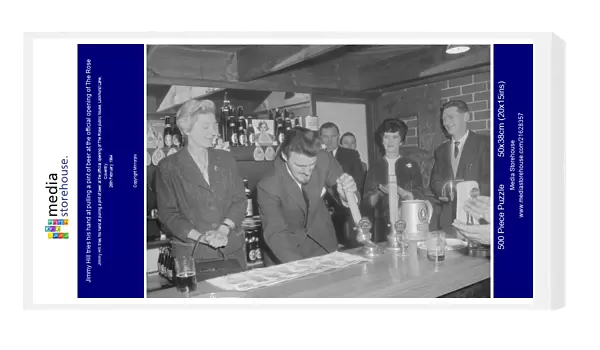 Jimmy Hill tries his hand at pulling a pint of beer at the official opening of The Rose