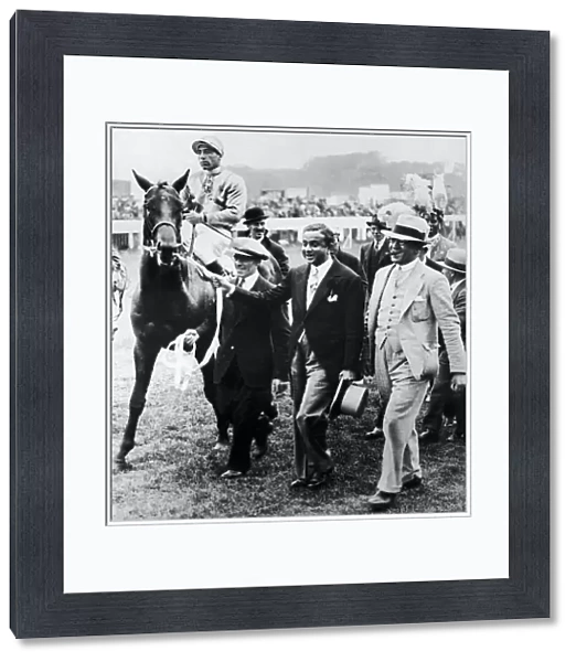 Windsor Lad ridden by Charlie Smirke being led in by the Maharajah of Rajpipla after