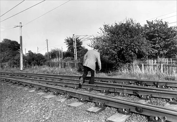A man crossing the railway line illegally on 13th May 1981