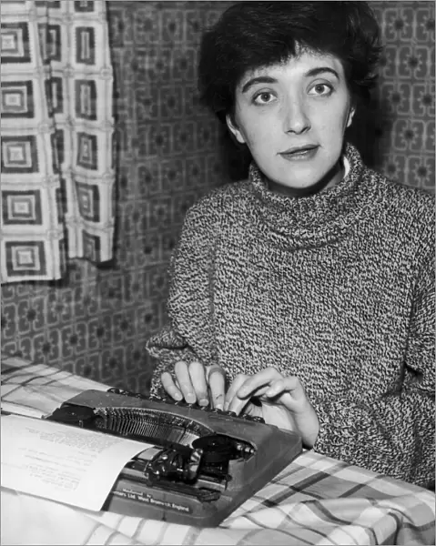 Salford born playwright Shelagh Delaney pictured at work on her typewriter at her home in