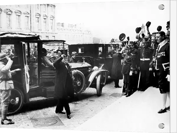Cheering crowds greet French Premier Georges Clemenceau as he arrives at the Palace of