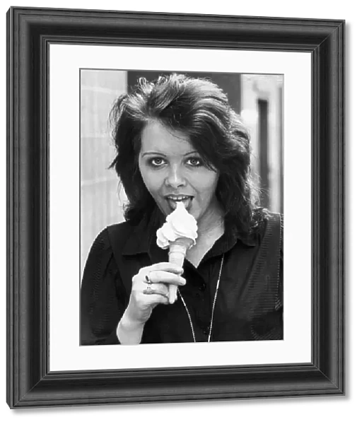 Anne Alexander gives a suggestive lick to a creamy ice cream cone. 15th May 1980