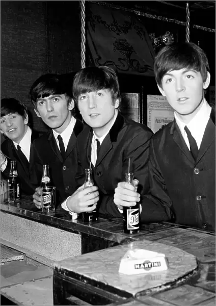 The Beatles at the bar in Paris with their Pepsi. Circa January 1964