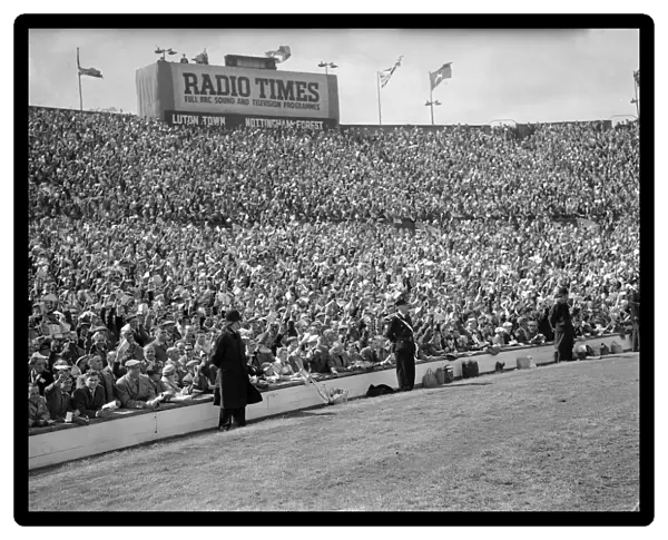 Crowds scenes during match action from the 1959 FA Cup Final at Wembley Stadium
