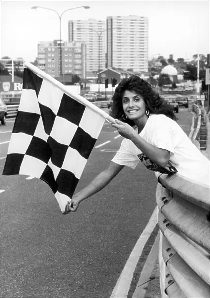 Maria Stevens, Beauty Queen, holding chequered flag at start of Halfords Birmingham Super