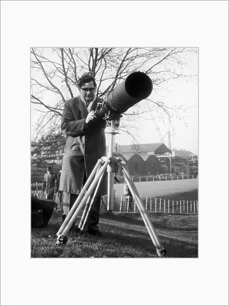 Daily Mirror Photographer Charles Ley seen here with a telephoto lens attached to his