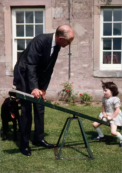 Sir Alec Douglas Home playing with his grand-daughter 1973