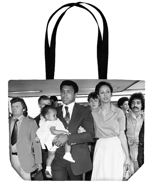 Muhammad Ali with second wife Veronica and their baby girl Hana arriving in England