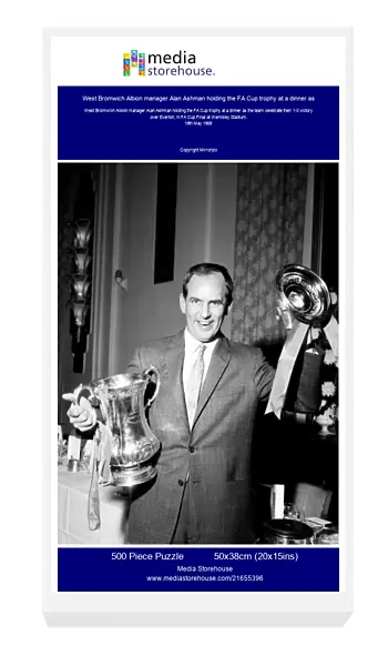 West Bromwich Albion manager Alan Ashman holding the FA Cup trophy at a dinner as