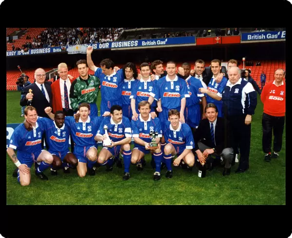 The Cardiff City team pictured with the Third Division title trophy