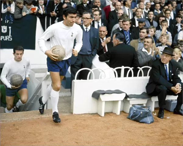 Tottenham Hotspur footballer Terry Venables walk out of the tunnel before his side