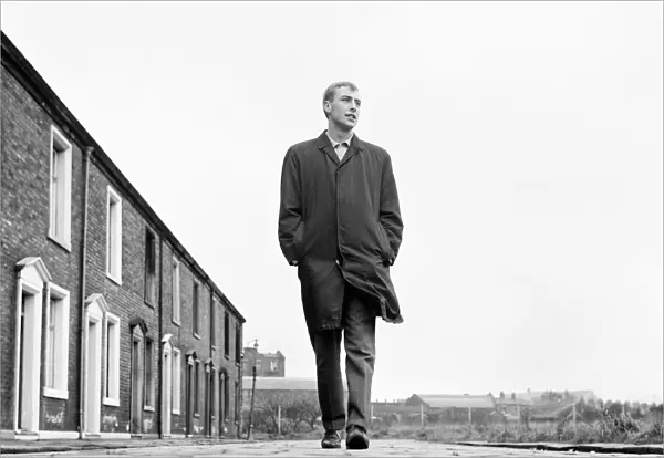 Blackburn Rovers forward John Byrom walking down the street where he lives