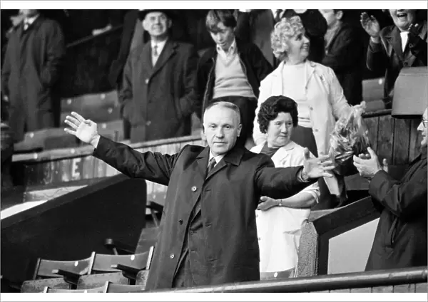Liverpool manager Bill Shankly acknowledges the cheers of the Kop ahead of his side