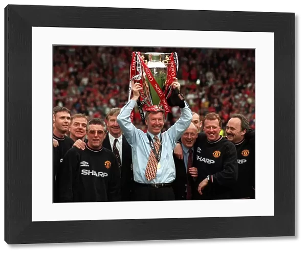 Alex Fergusonwith the Premiership trophy May 1999 on his headafter his Manchester