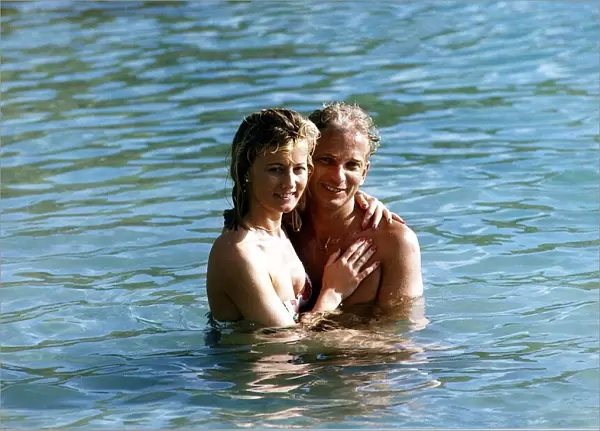 David Gower cricketer with Thorrun Nash in the sea during their visit to the West Indies