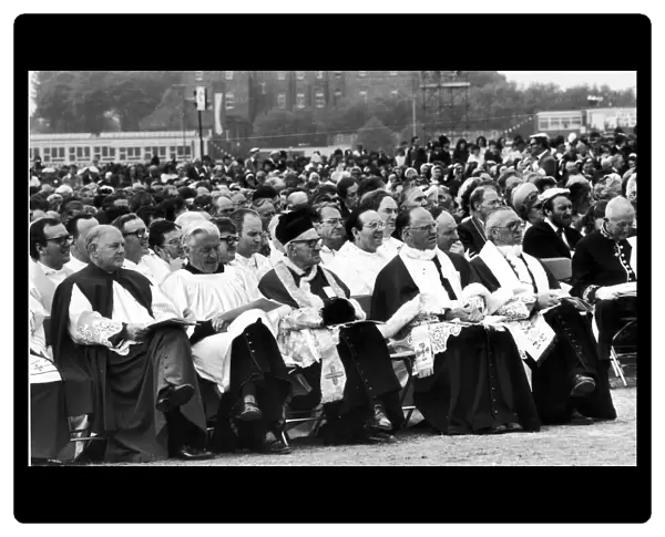 Attentive audience listen to Pope John Paul II Mass at Heaton Park, Manchester