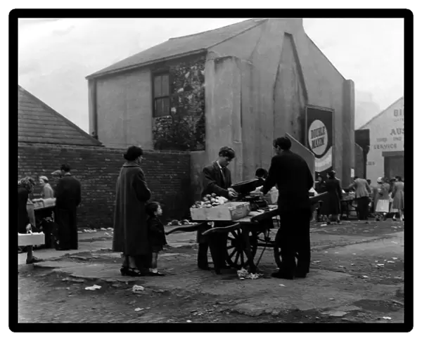 Barrow boys carry on trading at the Broughton Street site on 7th July 1958