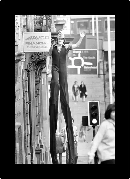 Walking Tall! World champion stilt walker John Long set some heads turning when he went