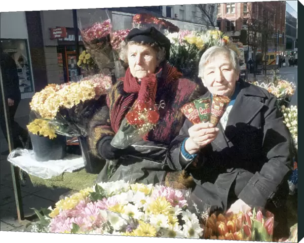 Nellie Halsted (left) the oldest flower girl in the country seen here at her Market