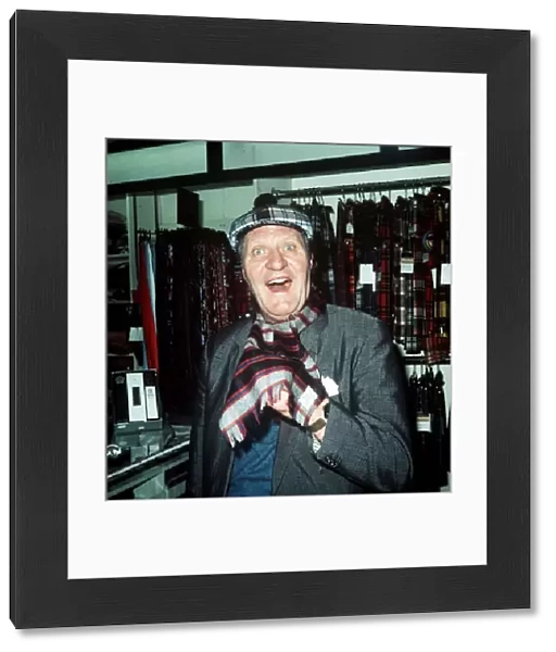 Comedian Tommy Cooper in a tartan shop 1974