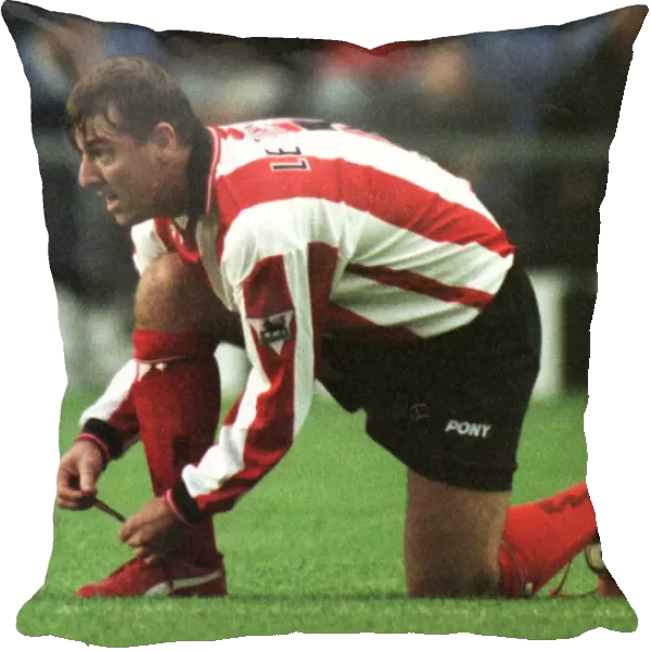 Southampton footballer Matthew Le Tissier putting on red boots during his side