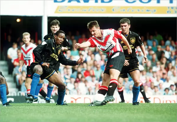 Southampton footballer Matthew Le Tissier on the ball faced by Paul Ince during their