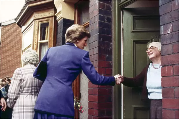 Princess Diana seen here shaking the hand of an elderly resident during her visit to