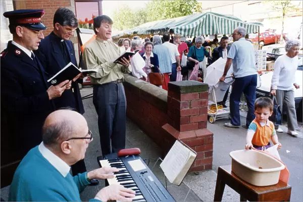 The clergy of Guisborough holding their annual charity sing-along outside the Guisborough