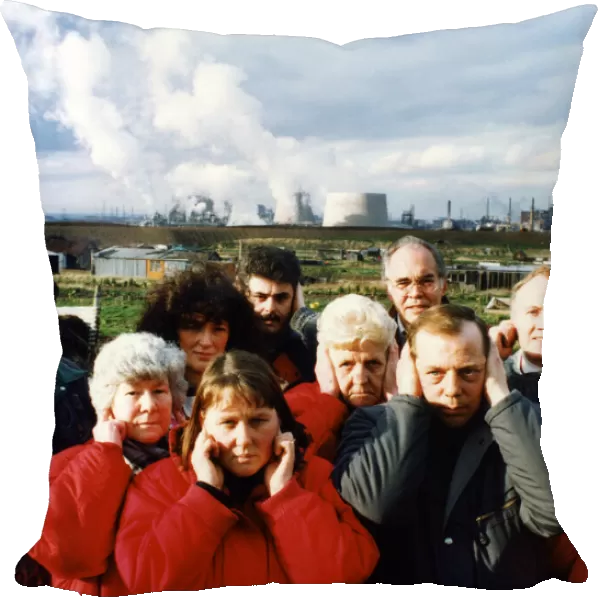 Residents of Lazanby cover their ears as the noise from the Enron site becomes unbearable
