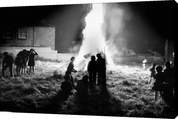Children gather around a bonfire in Everton. 5th November 1975